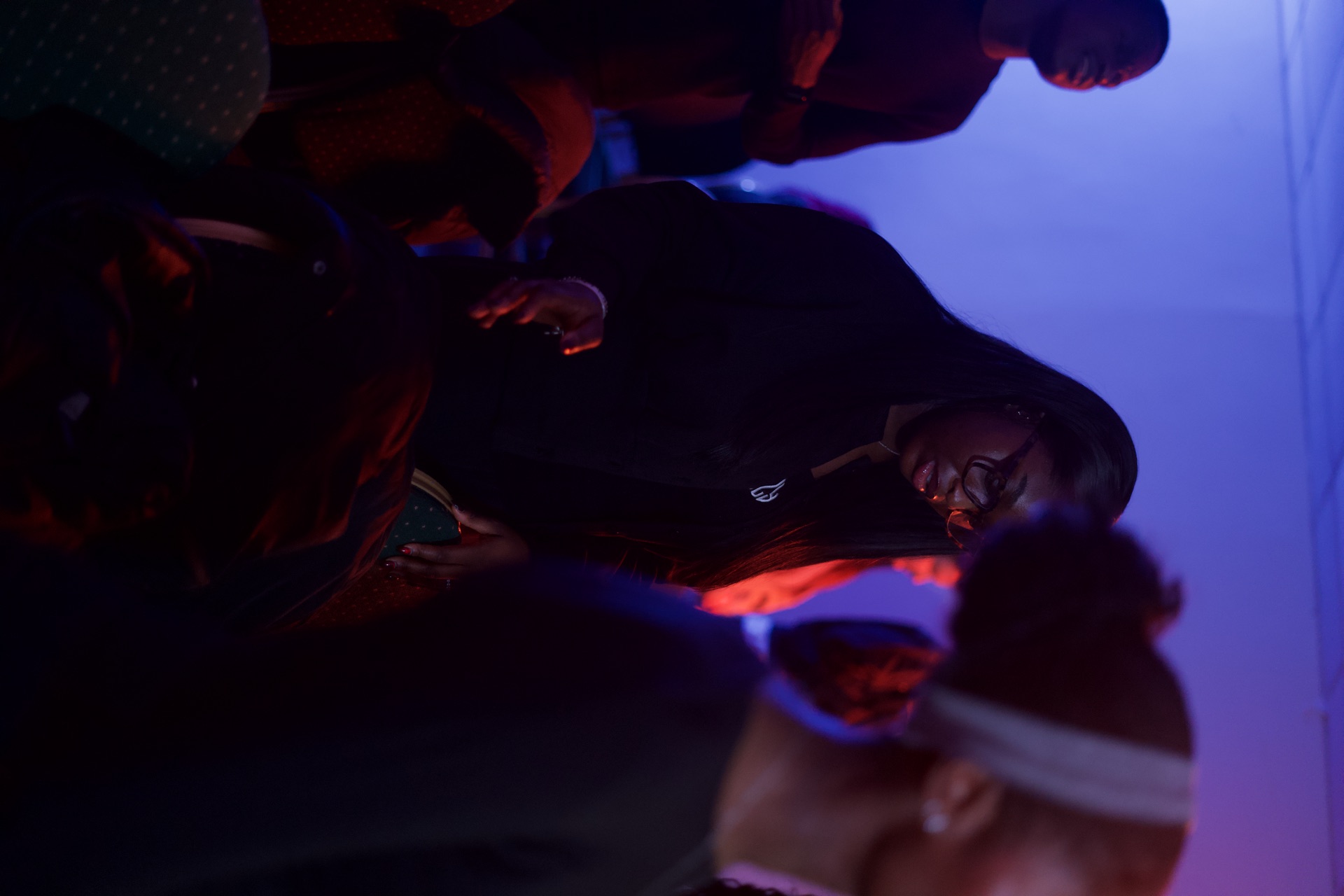 Low-light fellowship moment with people gathered together